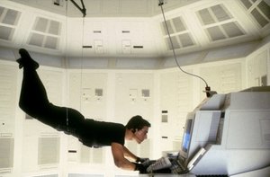 Tom Cruise hanging from the ceiling typing on a computer from Mission Impossible